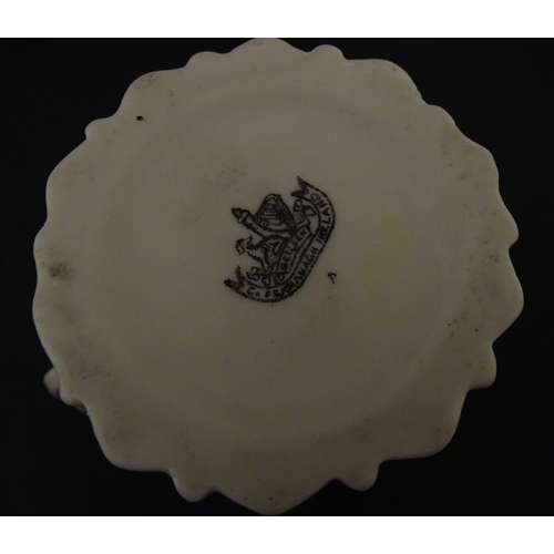 83 - Six assorted Belleek items comprising a cream jug in the Ampanida pattern, a small vase with bow det... 