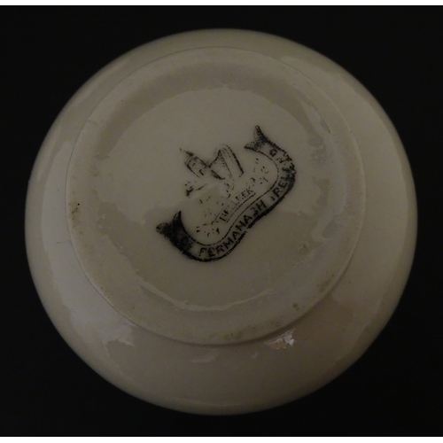 83 - Six assorted Belleek items comprising a cream jug in the Ampanida pattern, a small vase with bow det... 