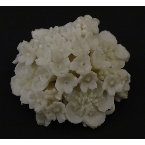 83 - Six assorted Belleek items comprising a cream jug in the Ampanida pattern, a small vase with bow det... 