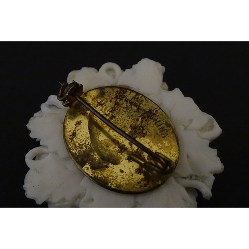 83 - Six assorted Belleek items comprising a cream jug in the Ampanida pattern, a small vase with bow det... 