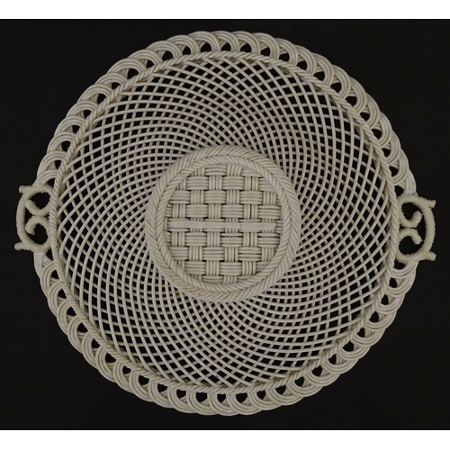 84 - Two Belleek four strand basket weave cake plates. Impressed marks under. Largest approx. 11 1/2