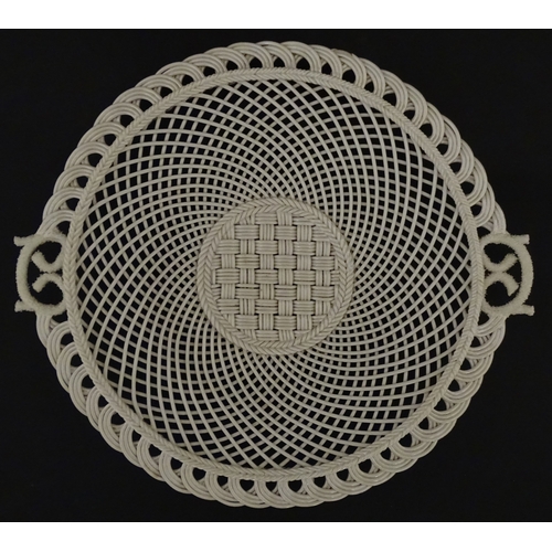 84 - Two Belleek four strand basket weave cake plates. Impressed marks under. Largest approx. 11 1/2