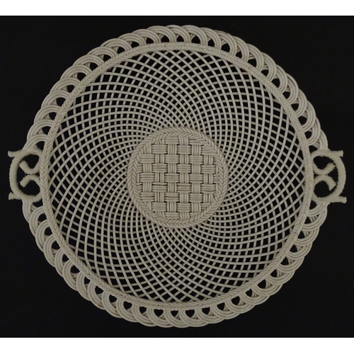 84 - Two Belleek four strand basket weave cake plates. Impressed marks under. Largest approx. 11 1/2