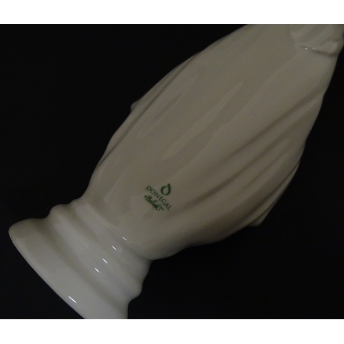 85 - A quantity of Belleek to include an Art Nouveau style butter dish with harpist lady and shamrock det... 