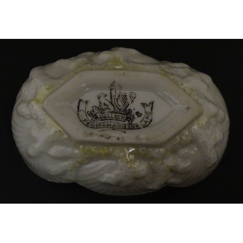 85 - A quantity of Belleek to include an Art Nouveau style butter dish with harpist lady and shamrock det... 