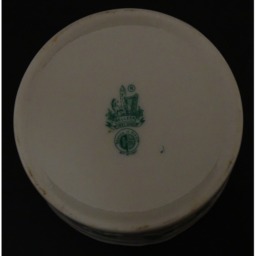 85 - A quantity of Belleek to include an Art Nouveau style butter dish with harpist lady and shamrock det... 