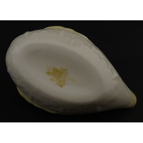 85 - A quantity of Belleek to include an Art Nouveau style butter dish with harpist lady and shamrock det... 