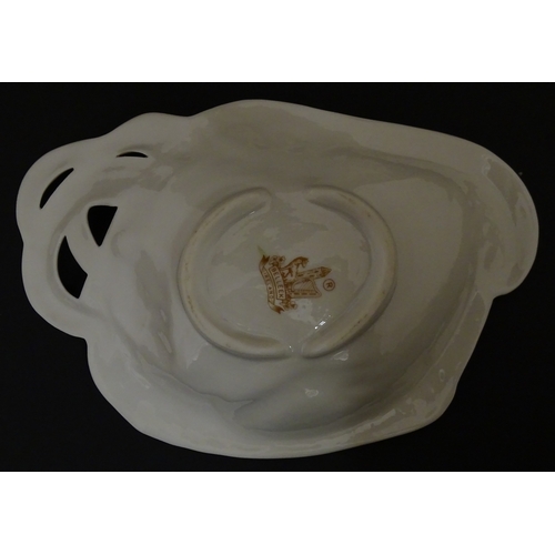 85 - A quantity of Belleek to include an Art Nouveau style butter dish with harpist lady and shamrock det... 