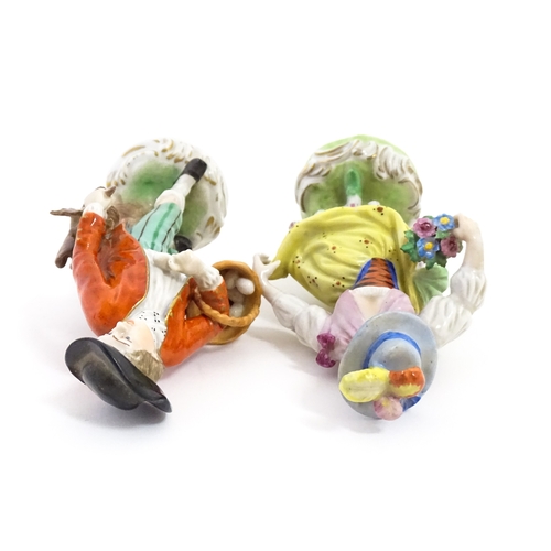 86 - Two Dresden figures comprising The Game Seller, and Lady with Flowers. Marked under. Approx. 6