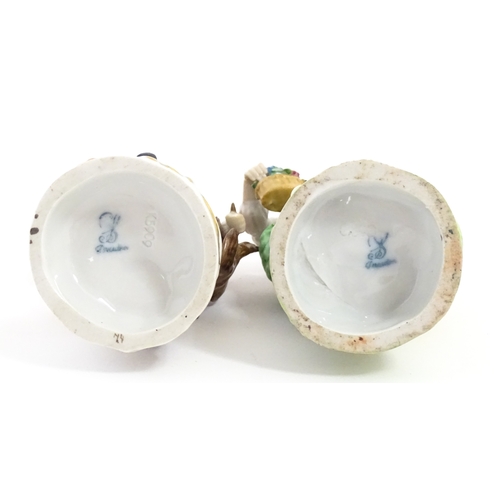 86 - Two Dresden figures comprising The Game Seller, and Lady with Flowers. Marked under. Approx. 6