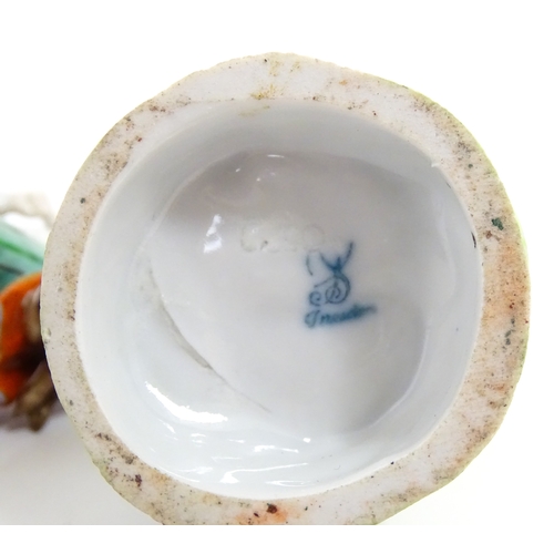 86 - Two Dresden figures comprising The Game Seller, and Lady with Flowers. Marked under. Approx. 6