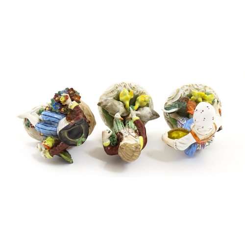 87 - Three Dresden figures comprising a Game Seller, Boy Feeding Geese, and Farm Girl with Chickens. Mark... 