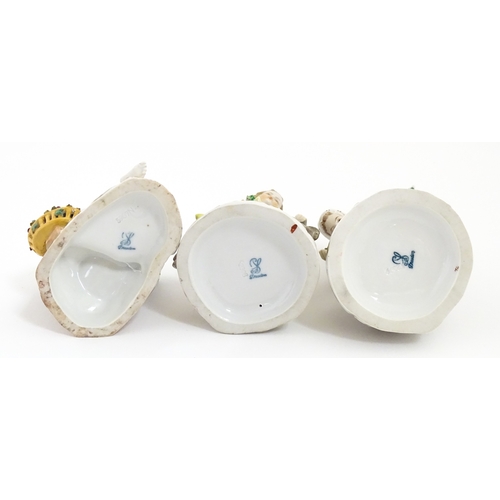 87 - Three Dresden figures comprising a Game Seller, Boy Feeding Geese, and Farm Girl with Chickens. Mark... 