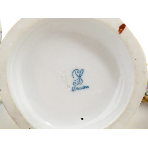 87 - Three Dresden figures comprising a Game Seller, Boy Feeding Geese, and Farm Girl with Chickens. Mark... 