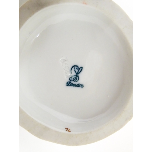 87 - Three Dresden figures comprising a Game Seller, Boy Feeding Geese, and Farm Girl with Chickens. Mark... 