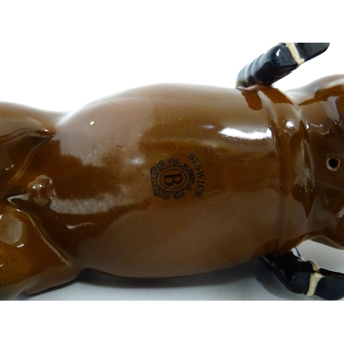 98 - Three Beswick models of horses comprising Huntsman on a Brown Horse, Shire Horse, and Cantering Shir... 