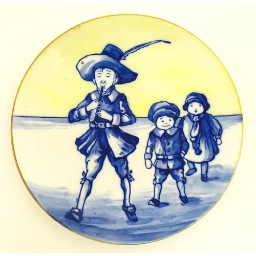 101 - A Royal Doulton nursery rhyme plate decorated with the Pied Piper, designed by J. Ogden, c. 1906. Ma... 