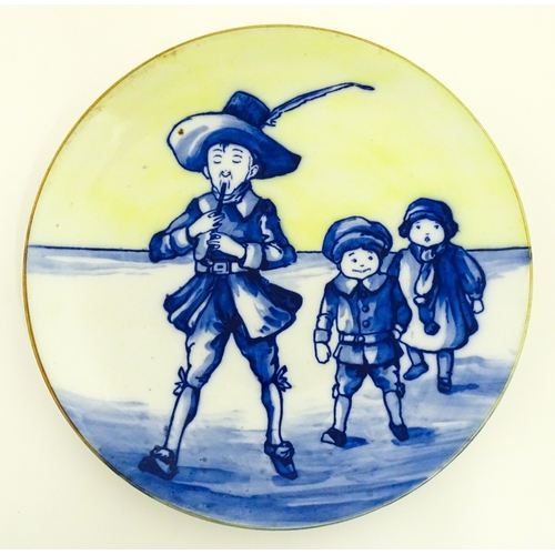 101 - A Royal Doulton nursery rhyme plate decorated with the Pied Piper, designed by J. Ogden, c. 1906. Ma... 