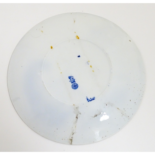 101 - A Royal Doulton nursery rhyme plate decorated with the Pied Piper, designed by J. Ogden, c. 1906. Ma... 