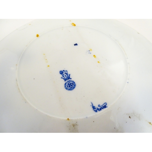 101 - A Royal Doulton nursery rhyme plate decorated with the Pied Piper, designed by J. Ogden, c. 1906. Ma... 