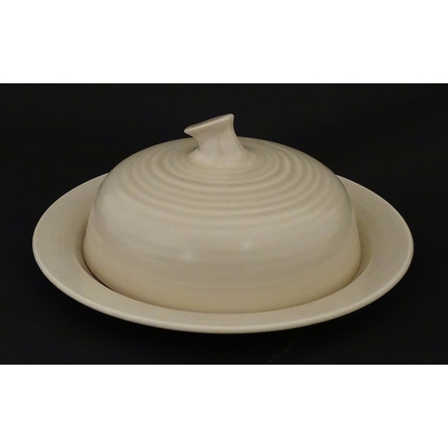 102 - A Wilkinson Clarice Cliff muffin dish. Marked under. Approx. 8 1/2