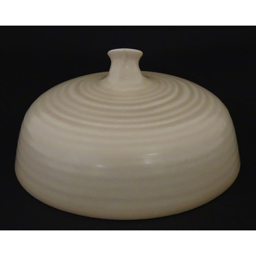 102 - A Wilkinson Clarice Cliff muffin dish. Marked under. Approx. 8 1/2