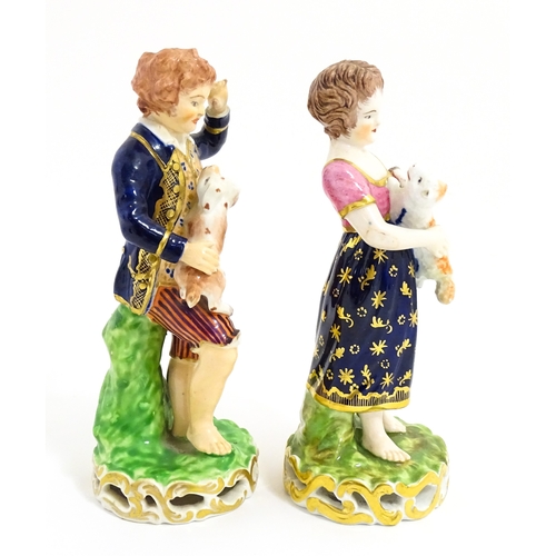 104 - A pair of Derby figures modelled as a boy holding a dog, and a girl holding a lamb. Marked under. Ap... 