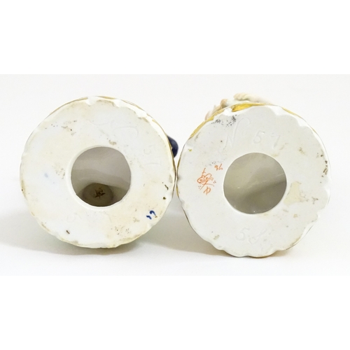 104 - A pair of Derby figures modelled as a boy holding a dog, and a girl holding a lamb. Marked under. Ap... 