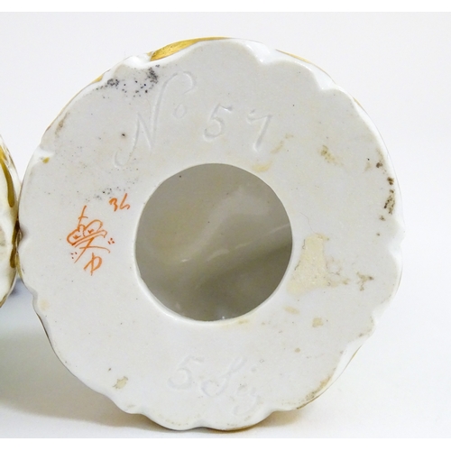 104 - A pair of Derby figures modelled as a boy holding a dog, and a girl holding a lamb. Marked under. Ap... 