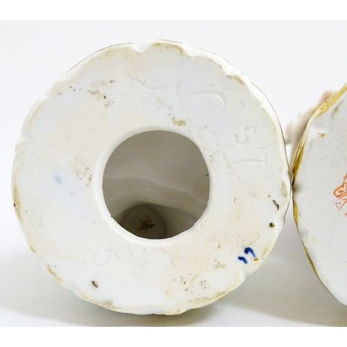 104 - A pair of Derby figures modelled as a boy holding a dog, and a girl holding a lamb. Marked under. Ap... 