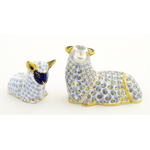 108 - A Royal Crown Derby paperweight modelled as a ram / sheep. Together with a Royal Crown Derby paperwe... 