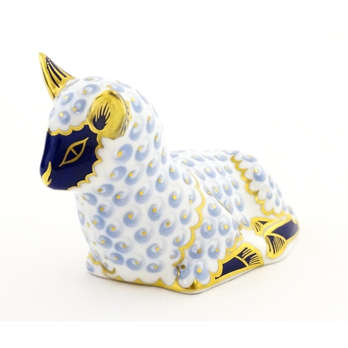 108 - A Royal Crown Derby paperweight modelled as a ram / sheep. Together with a Royal Crown Derby paperwe... 