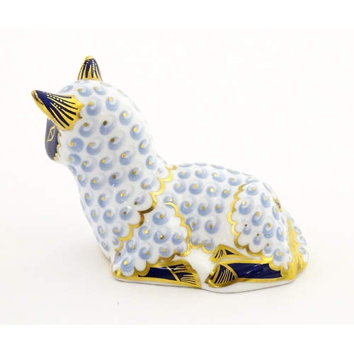 108 - A Royal Crown Derby paperweight modelled as a ram / sheep. Together with a Royal Crown Derby paperwe... 