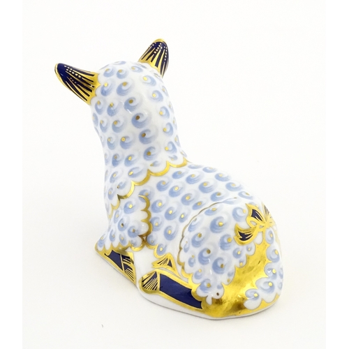 108 - A Royal Crown Derby paperweight modelled as a ram / sheep. Together with a Royal Crown Derby paperwe... 