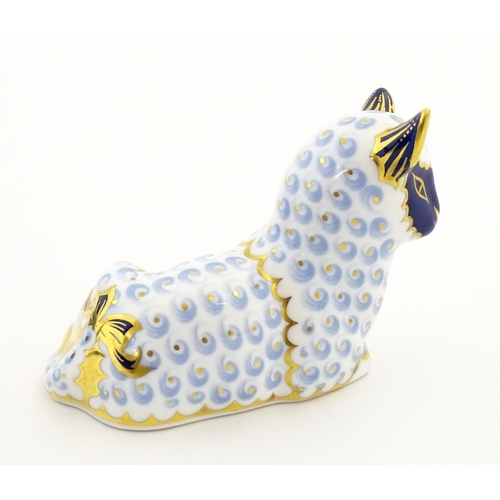 108 - A Royal Crown Derby paperweight modelled as a ram / sheep. Together with a Royal Crown Derby paperwe... 