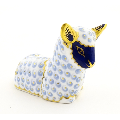 108 - A Royal Crown Derby paperweight modelled as a ram / sheep. Together with a Royal Crown Derby paperwe... 