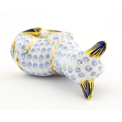 108 - A Royal Crown Derby paperweight modelled as a ram / sheep. Together with a Royal Crown Derby paperwe... 