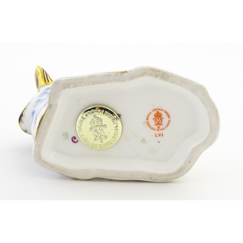 108 - A Royal Crown Derby paperweight modelled as a ram / sheep. Together with a Royal Crown Derby paperwe... 