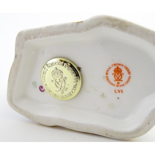 108 - A Royal Crown Derby paperweight modelled as a ram / sheep. Together with a Royal Crown Derby paperwe... 