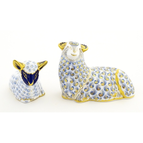 108 - A Royal Crown Derby paperweight modelled as a ram / sheep. Together with a Royal Crown Derby paperwe... 