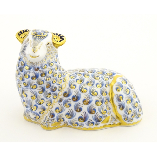108 - A Royal Crown Derby paperweight modelled as a ram / sheep. Together with a Royal Crown Derby paperwe... 