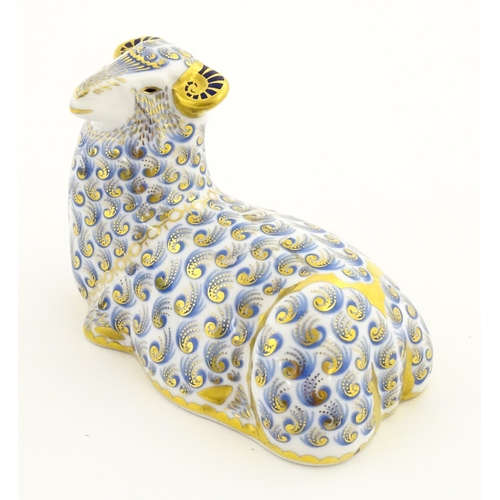 108 - A Royal Crown Derby paperweight modelled as a ram / sheep. Together with a Royal Crown Derby paperwe... 