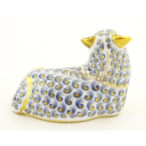 108 - A Royal Crown Derby paperweight modelled as a ram / sheep. Together with a Royal Crown Derby paperwe... 