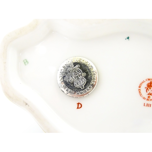 108 - A Royal Crown Derby paperweight modelled as a ram / sheep. Together with a Royal Crown Derby paperwe... 