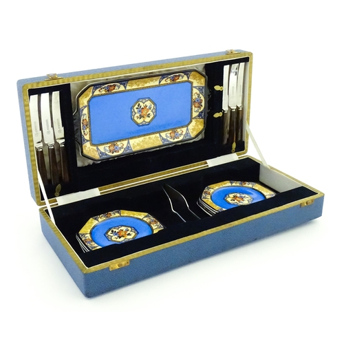 110 - A cased Wedgwood cake / sandwich service in the Melody pattern comprising serving plate, cake plates... 