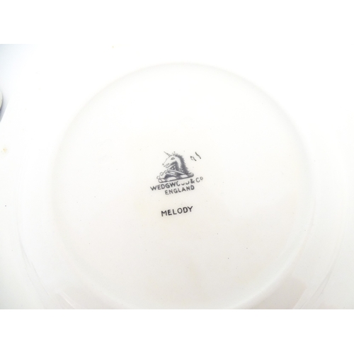 110 - A cased Wedgwood cake / sandwich service in the Melody pattern comprising serving plate, cake plates... 