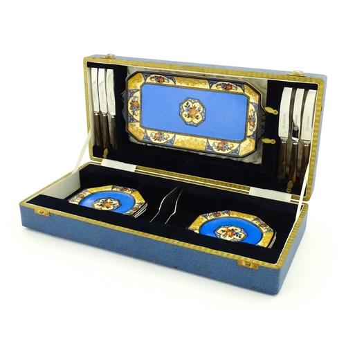 110 - A cased Wedgwood cake / sandwich service in the Melody pattern comprising serving plate, cake plates... 