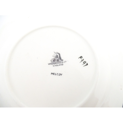 110 - A cased Wedgwood cake / sandwich service in the Melody pattern comprising serving plate, cake plates... 