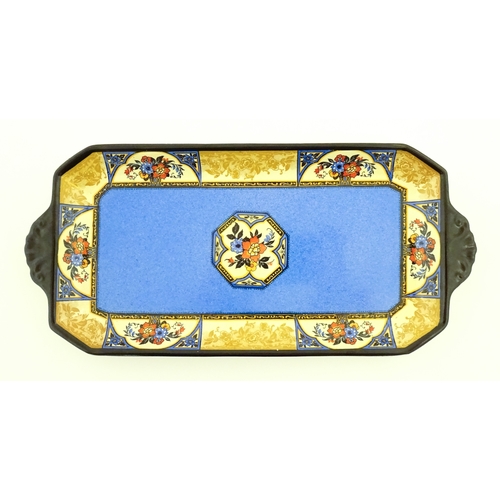 110 - A cased Wedgwood cake / sandwich service in the Melody pattern comprising serving plate, cake plates... 