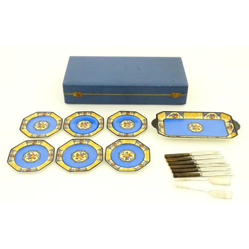 110 - A cased Wedgwood cake / sandwich service in the Melody pattern comprising serving plate, cake plates... 